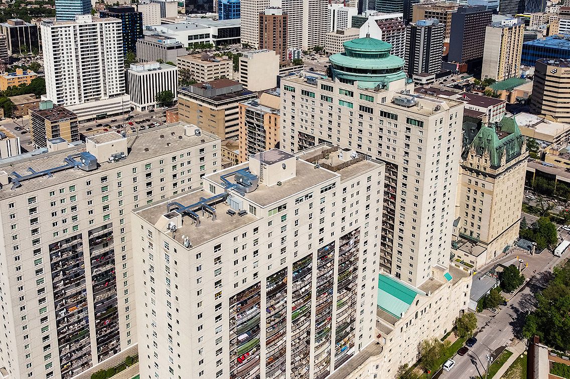 25-floor concrete apartment building located downtown in one of Winnipeg's most iconic buildings